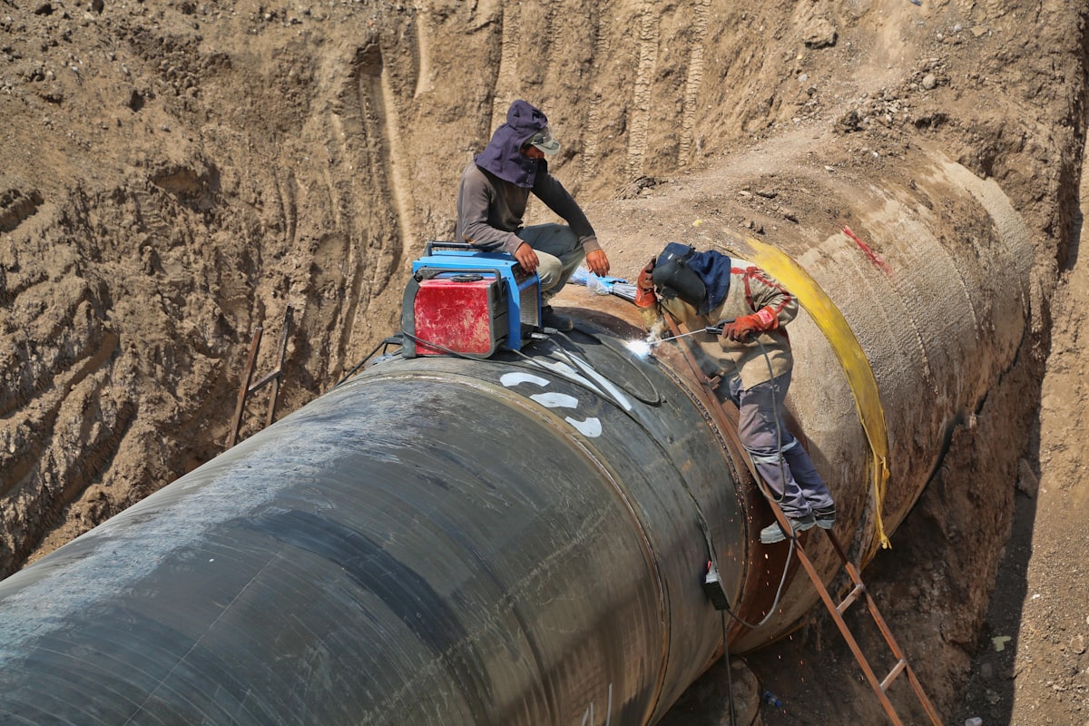 Technicians performing safety-focused pipeline maintenance