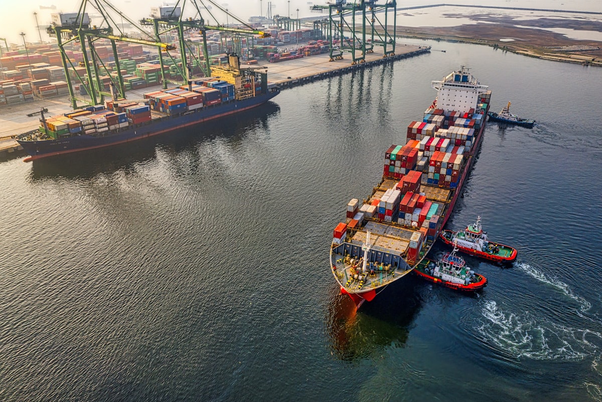 Cargo vessels and cranes at a shipping port